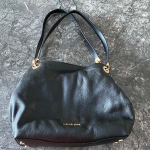 Michael Kors purse, purse protector, and wristlet
